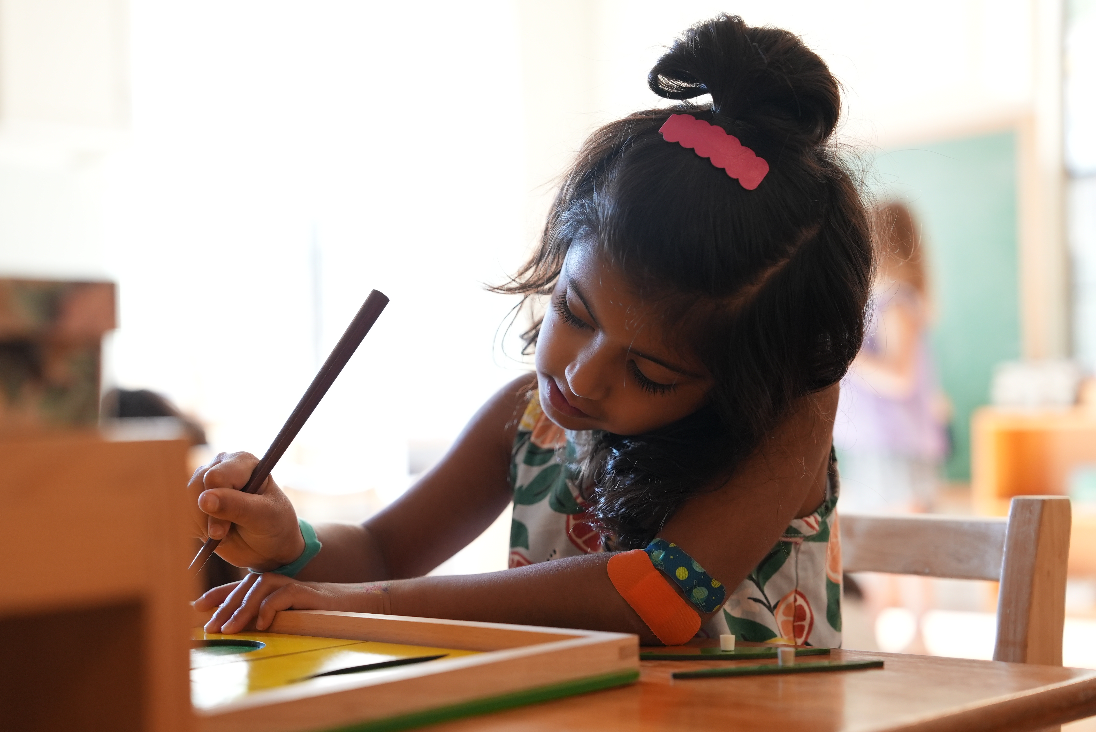 A child fully absorbed in her work.