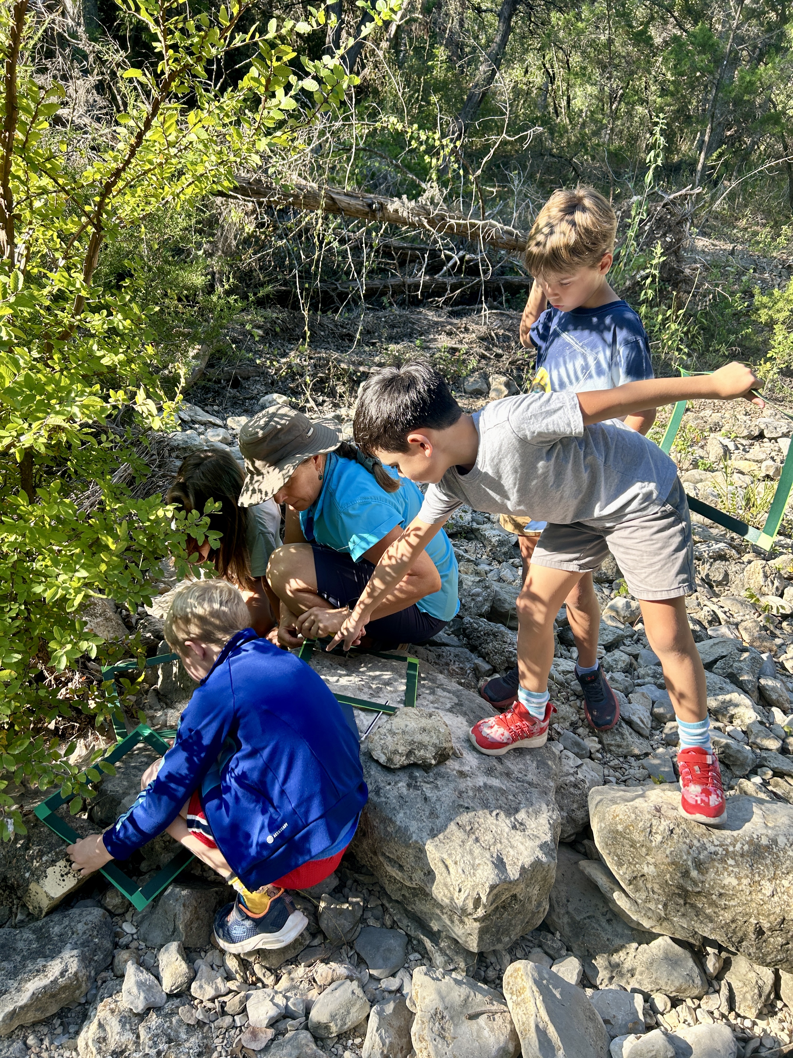 Children exploring outdoors, becoming who they are.