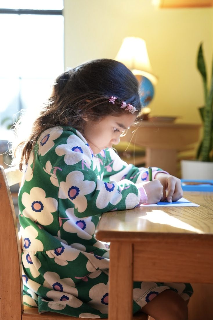 A child at work in a Montessori classroom