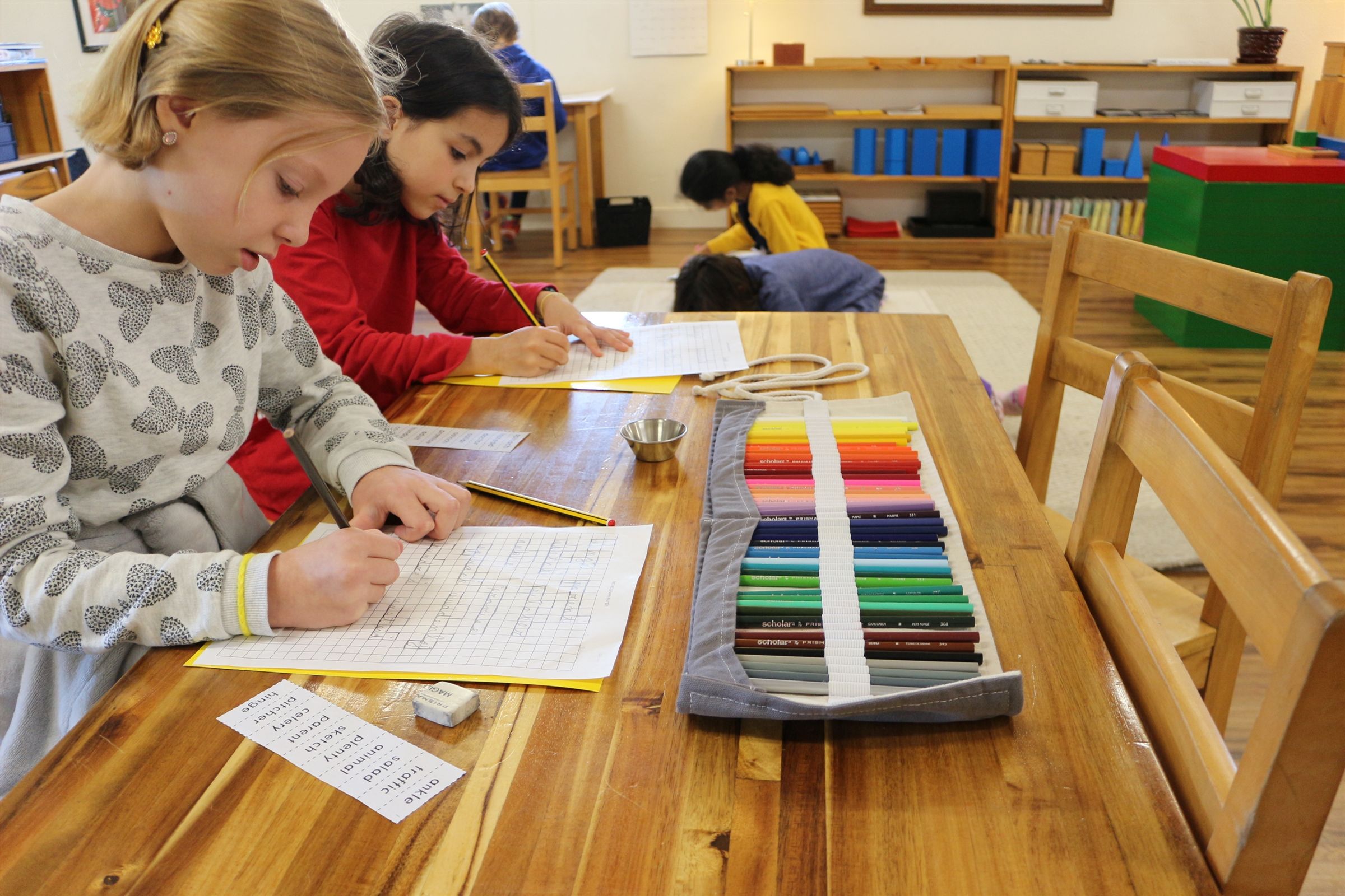A child working with concrete Montessori materials at Austin Montessori School