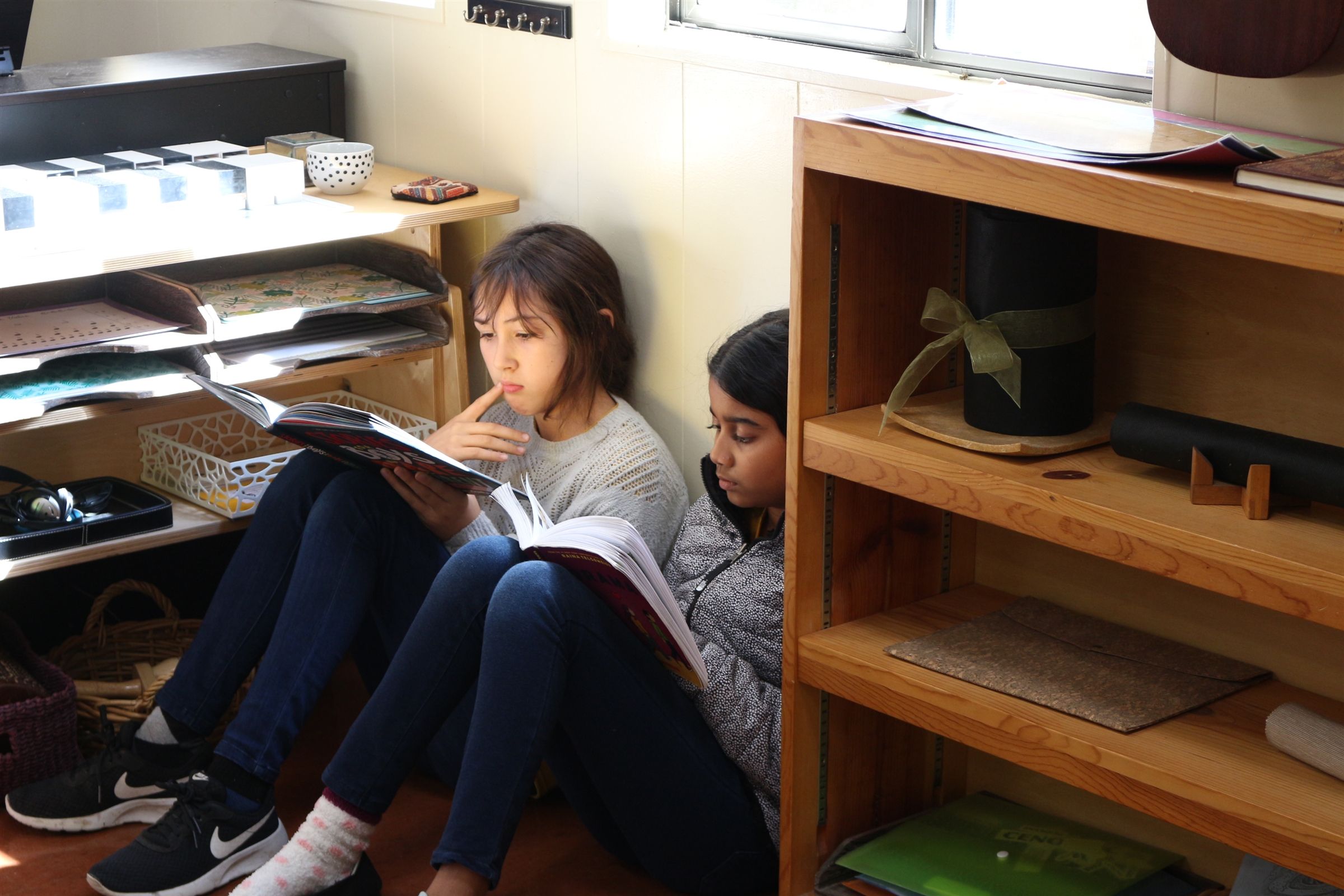 Children engaged in hands-on work at Austin Montessori School